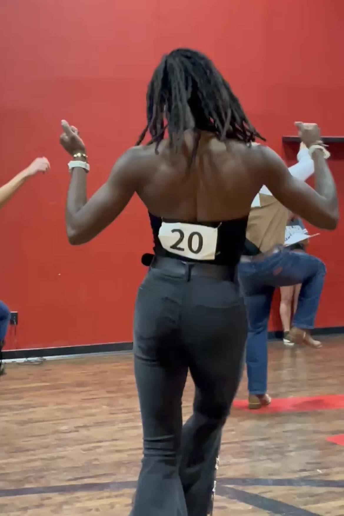 African American Line Dancer With Arms Up Showing Flair