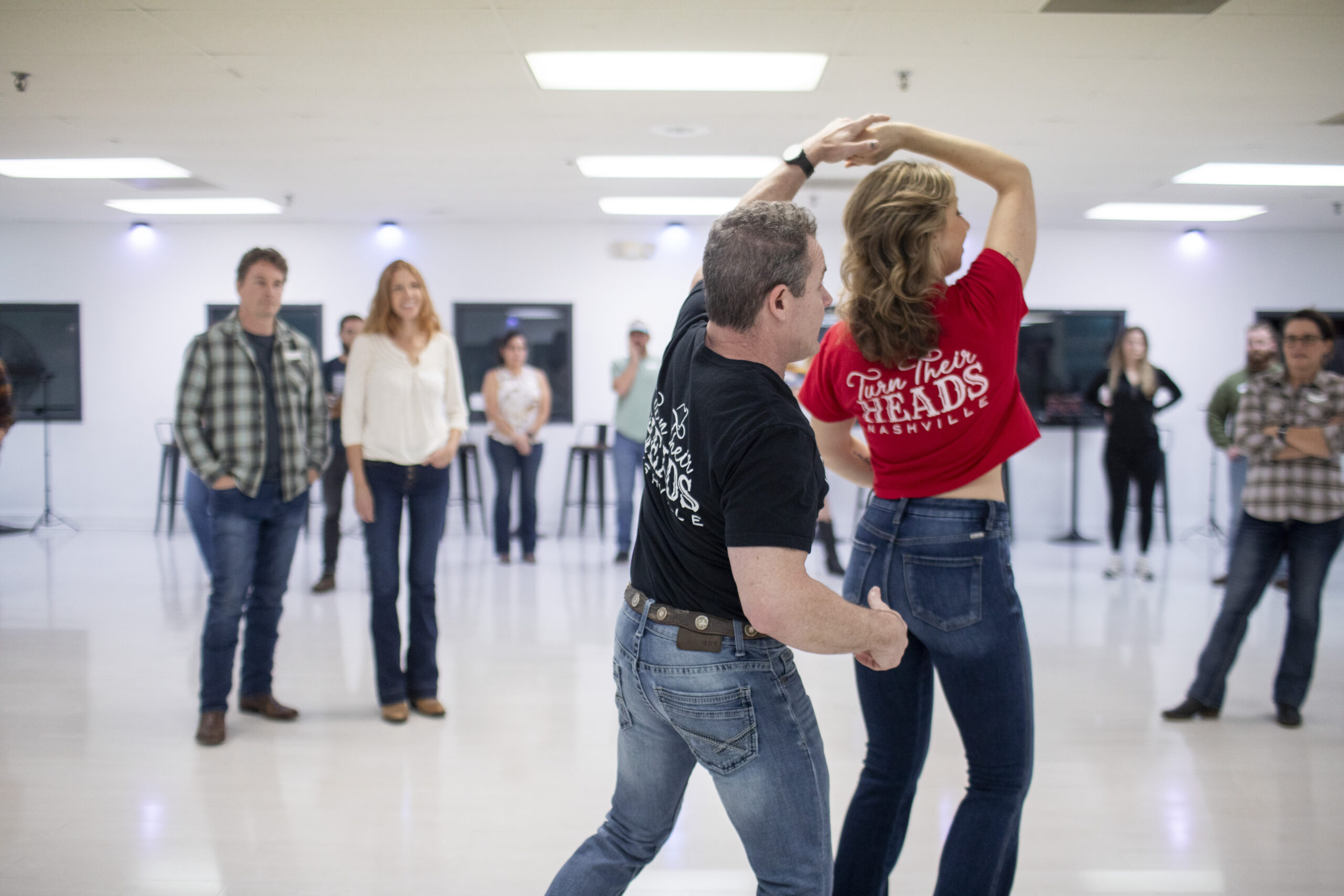 Instructors Demonstrating A Country Swing Turn