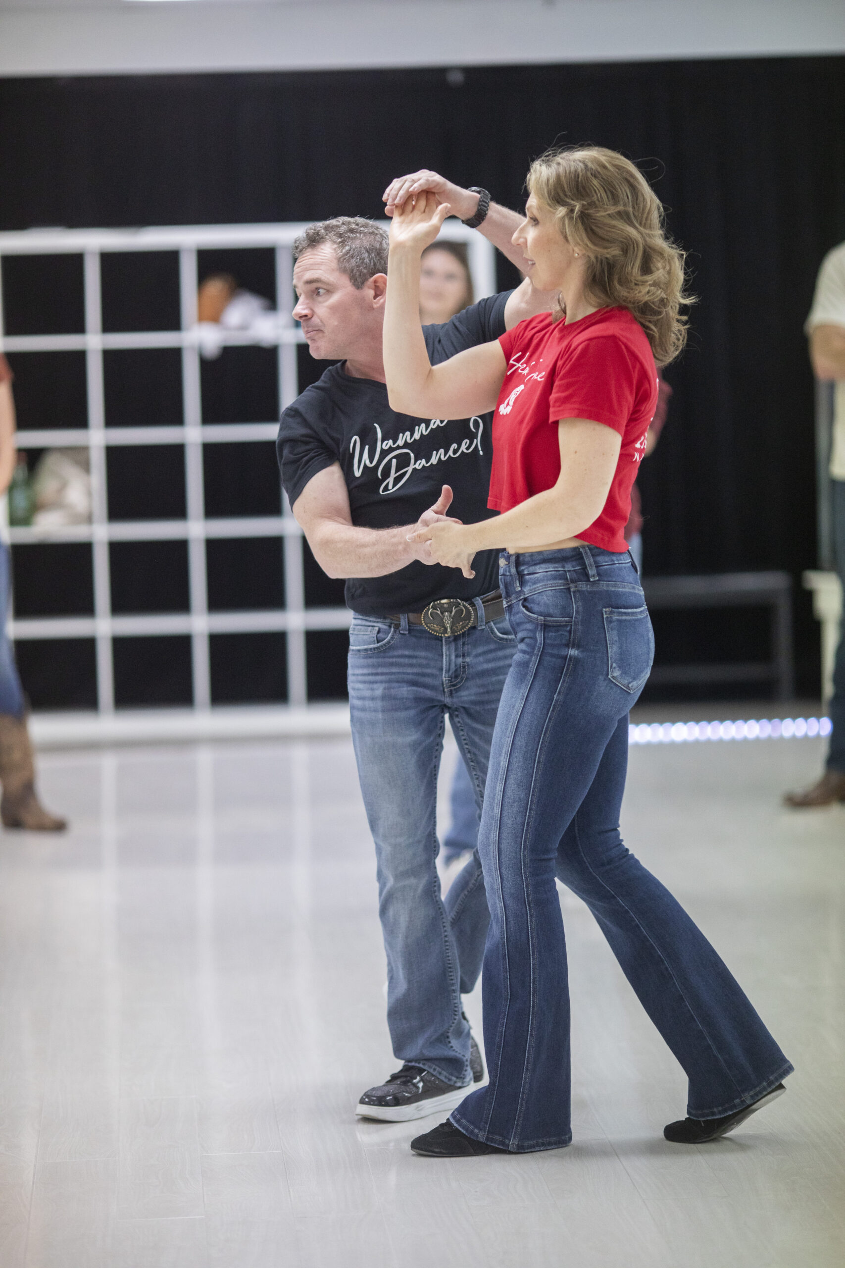 Country swing instructors teaching a turn