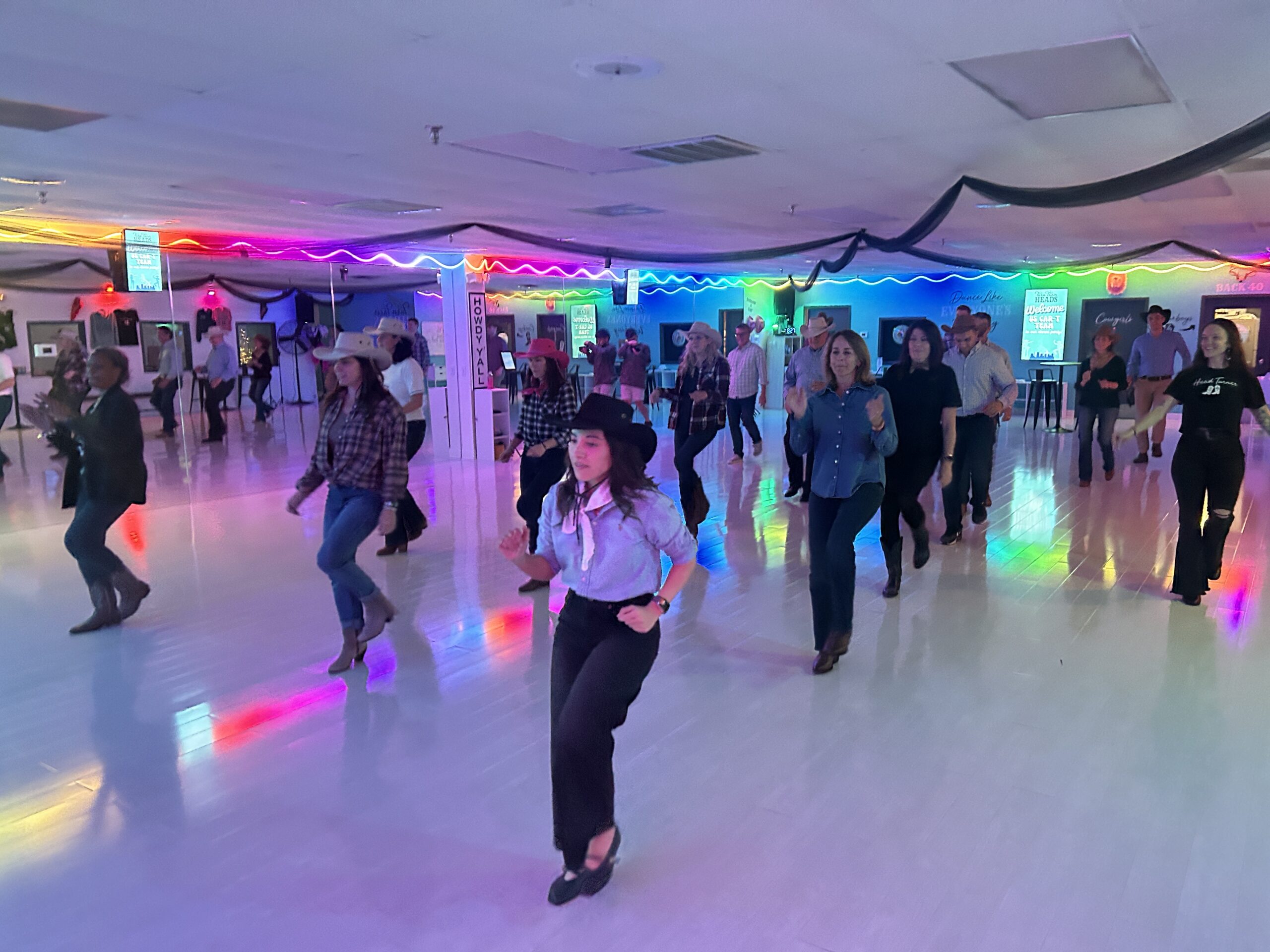 Image_20251119_004005_790 Company having a line dance lesson in Nashville